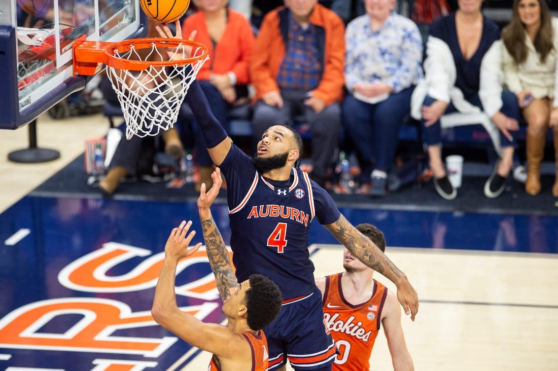 Auburn Tigers player Johni Broome (4) attempts to tip the ball as Auburn Tigers take on Virginia Tech Hokies at Neville Arena in Auburn, Ala., on Wednesday, Nov. 29, 2023. Auburn Tigers defeated Virginia Tech Hokies 74-57.