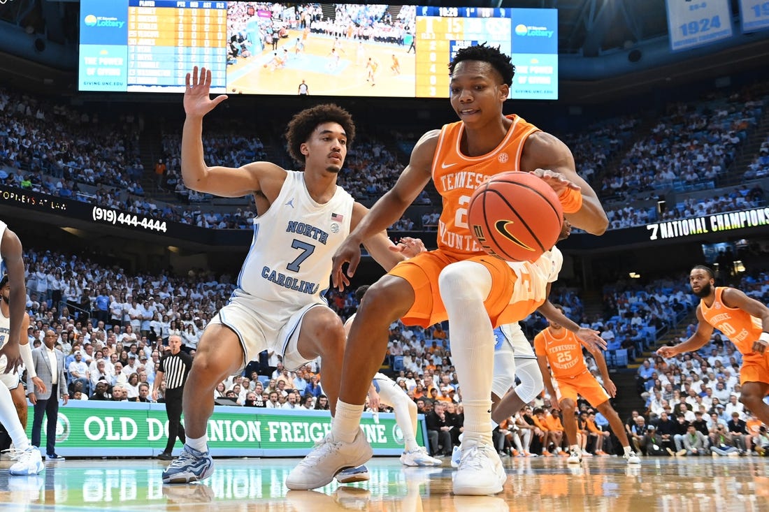 Nov 29, 2023; Chapel Hill, North Carolina, USA; Tennessee Volunteers guard Jordan Gainey (2) dribbles as North Carolina Tar Heels guard Seth Trimble (7) defends in the first half at Dean E. Smith Center. Mandatory Credit: Bob Donnan-USA TODAY Sports