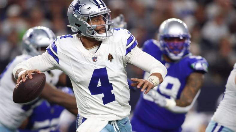 Nov 30, 2023; Arlington, Texas, USA; Dallas Cowboys quarterback Dak Prescott (4) throws a pass against the Seattle Seahawks during the second half at AT&T Stadium. Mandatory Credit: Tim Heitman-USA TODAY Sports