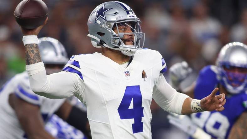 Nov 30, 2023; Arlington, Texas, USA; Dallas Cowboys quarterback Dak Prescott (4) throws a pass against the Seattle Seahawks during the second half at AT&T Stadium. Mandatory Credit: Tim Heitman-USA TODAY Sports