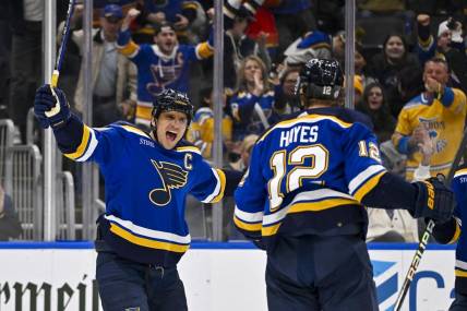 Nov 30, 2023; St. Louis, Missouri, USA;  St. Louis Blues right wing Kevin Hayes (12) is congratulated by center Brayden Schenn (10) after scoring against the Buffalo Sabres during the second period at Enterprise Center. Mandatory Credit: Jeff Curry-USA TODAY Sports
