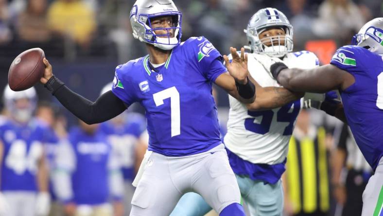 Nov 30, 2023; Arlington, Texas, USA; Seattle Seahawks quarterback Geno Smith (7) throws to pass against the Dallas Cowboys during the second half at AT&T Stadium. Mandatory Credit: Tim Heitman-USA TODAY Sports