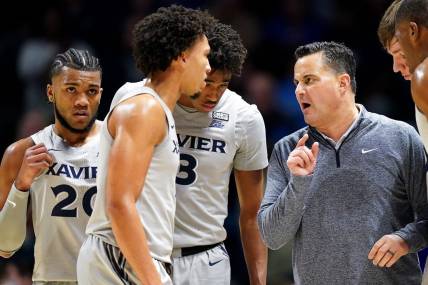 Xavier Musketeers head coach Sean Miller talks with the team during a timeout in the first half of an NCAA college basketball game between the Houston Cougars and the Xavier Musketeers, Friday, Dec. 1, 2023, at Cintas Center in Cincinnati.