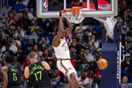 Dec 1, 2023; New Orleans, Louisiana, USA; San Antonio Spurs center Charles Bassey (28) dunks the ball against New Orleans Pelicans center Jonas Valanciunas (17) during the first half at the Smoothie King Center. Mandatory Credit: Stephen Lew-USA TODAY Sports