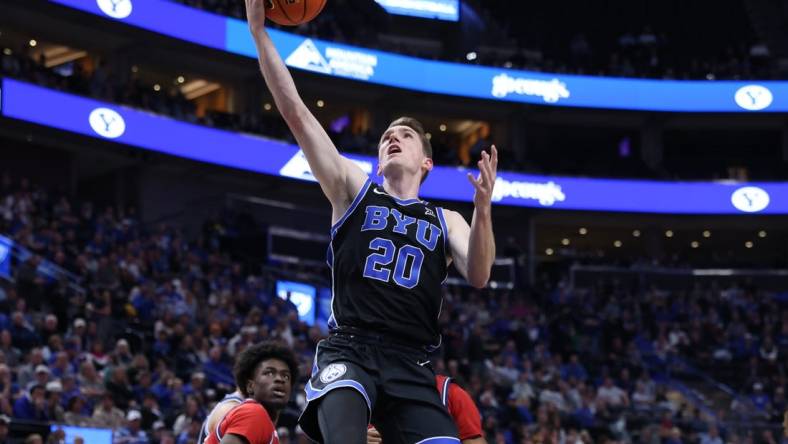 Dec 1, 2023; Salt Lake City, Utah, USA; Brigham Young Cougars guard Spencer Johnson (20) lays the ball up against the Fresno State Bulldogs during the first half at Delta Center. Mandatory Credit: Rob Gray-USA TODAY Sports