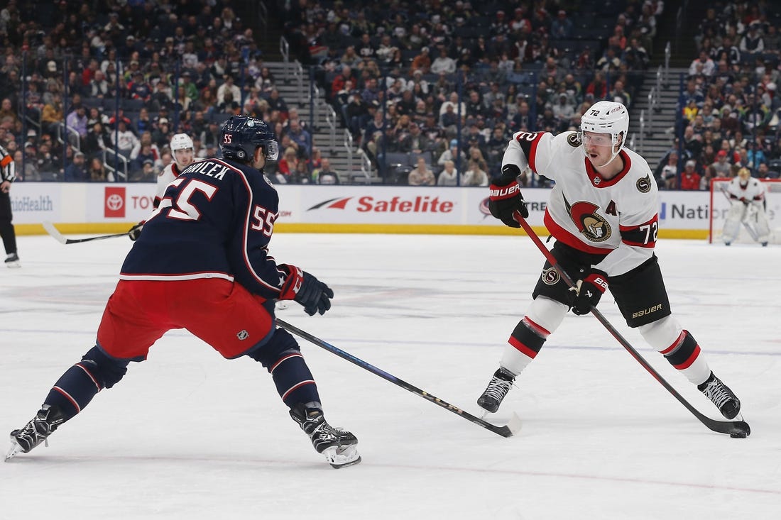 Dec 1, 2023; Columbus, Ohio, USA; Ottawa Senators defenseman Thomas Chabot (72) takes a shot as Columbus Blue Jackets defenseman David Jiricek (55) defends during the third period at Nationwide Arena. Mandatory Credit: Russell LaBounty-USA TODAY Sports