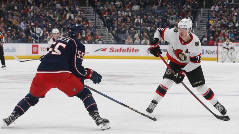 Dec 1, 2023; Columbus, Ohio, USA; Ottawa Senators defenseman Thomas Chabot (72) takes a shot as Columbus Blue Jackets defenseman David Jiricek (55) defends during the third period at Nationwide Arena. Mandatory Credit: Russell LaBounty-USA TODAY Sports