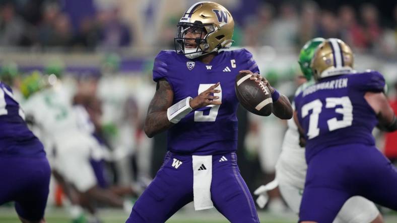 Dec 1, 2023; Las Vegas, NV, USA; Washington Huskies quarterback Michael Penix Jr. (9) throws the ball against the Oregon Ducks  in the first half at Allegiant Stadium. Mandatory Credit: Kirby Lee-USA TODAY Sports