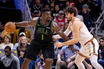 Dec 1, 2023; New Orleans, Louisiana, USA; New Orleans Pelicans forward Zion Williamson (1) looks for separation against San Antonio Spurs forward Cedi Osman (16) during the second half at the Smoothie King Center. Mandatory Credit: Stephen Lew-USA TODAY Sports