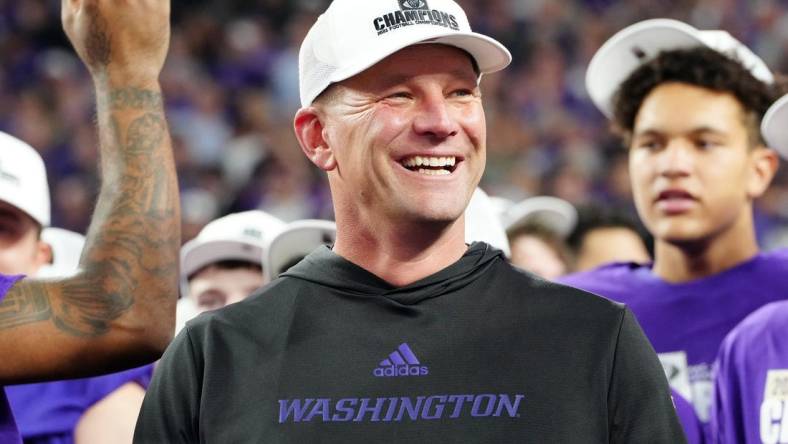 Dec 1, 2023; Las Vegas, NV, USA; Washington Huskies head coach Kalen DeBoer reacts as players celebrate after the Huskies defeated the Oregon Ducks 31-34 to win the Pac-12 Championship at Allegiant Stadium. Mandatory Credit: Stephen R. Sylvanie-USA TODAY Sports