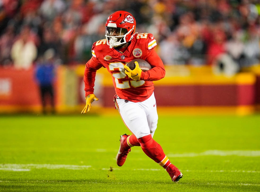 Nov 20, 2023; Kansas City, Missouri, USA; Kansas City Chiefs running back Clyde Edwards-Helaire (25) runs the ball during the first half against the Philadelphia Eagles at GEHA Field at Arrowhead Stadium. Mandatory Credit: Jay Biggerstaff-USA TODAY Sports