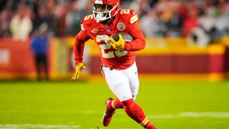 Nov 20, 2023; Kansas City, Missouri, USA; Kansas City Chiefs running back Clyde Edwards-Helaire (25) runs the ball during the first half against the Philadelphia Eagles at GEHA Field at Arrowhead Stadium. Mandatory Credit: Jay Biggerstaff-USA TODAY Sports