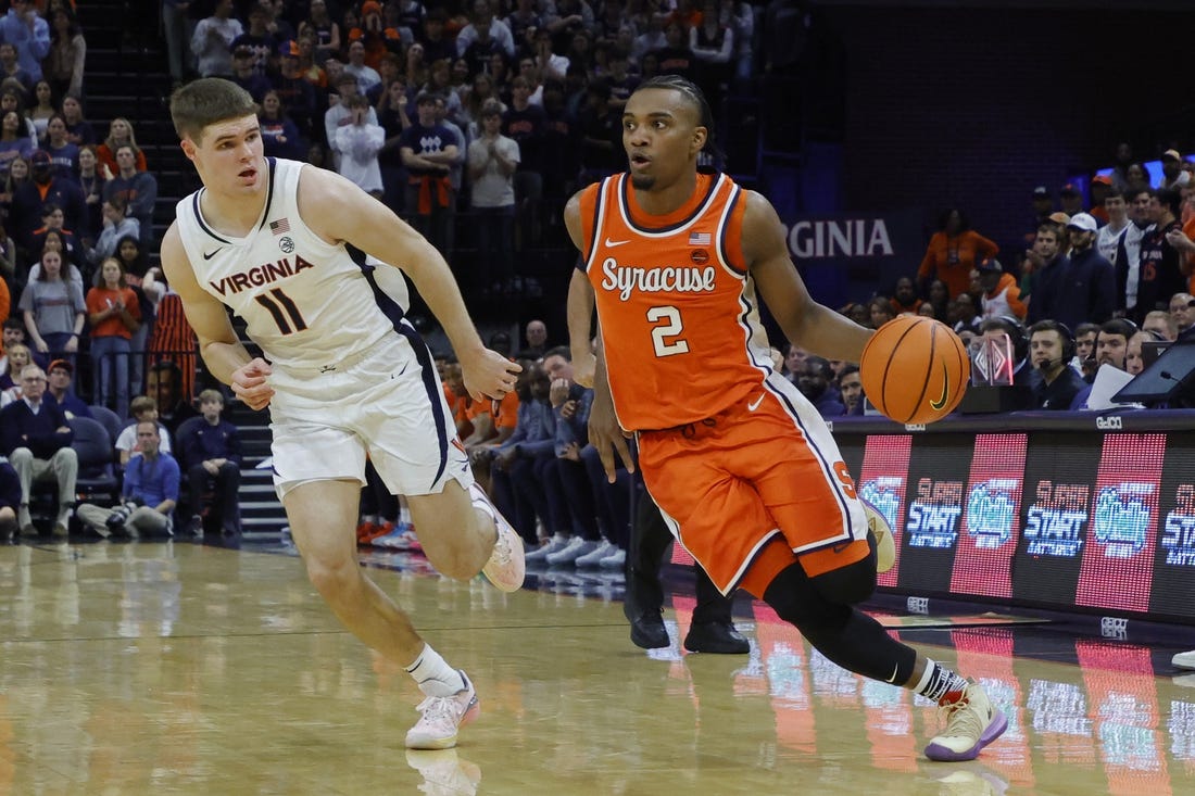 Dec 2, 2023; Charlottesville, Virginia, USA; Syracuse Orange guard JJ Starling (2) drives to the basket as Virginia Cavaliers guard Isaac McKneely (11) defends during the first half at John Paul Jones Arena. Mandatory Credit: Geoff Burke-USA TODAY Sports