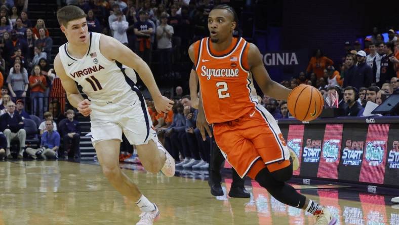 Dec 2, 2023; Charlottesville, Virginia, USA; Syracuse Orange guard JJ Starling (2) drives to the basket as Virginia Cavaliers guard Isaac McKneely (11) defends during the first half at John Paul Jones Arena. Mandatory Credit: Geoff Burke-USA TODAY Sports