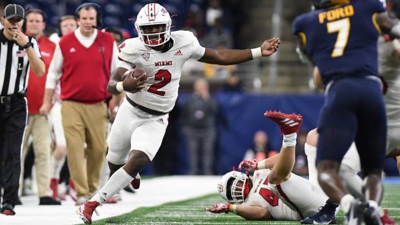 Dec 2, 2023; Detroit, MI, USA; Miami (OH) Redhawks quarterback Aveon Smith (2) runs up the sidelines against the Toledo Rockets in the third quarter at Ford Field. Mandatory Credit: Lon Horwedel-USA TODAY Sports