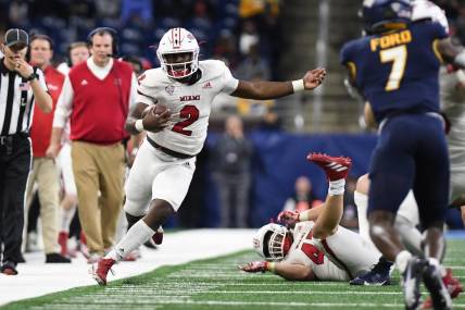 Dec 2, 2023; Detroit, MI, USA; Miami (OH) Redhawks quarterback Aveon Smith (2) runs up the sidelines against the Toledo Rockets in the third quarter at Ford Field. Mandatory Credit: Lon Horwedel-USA TODAY Sports