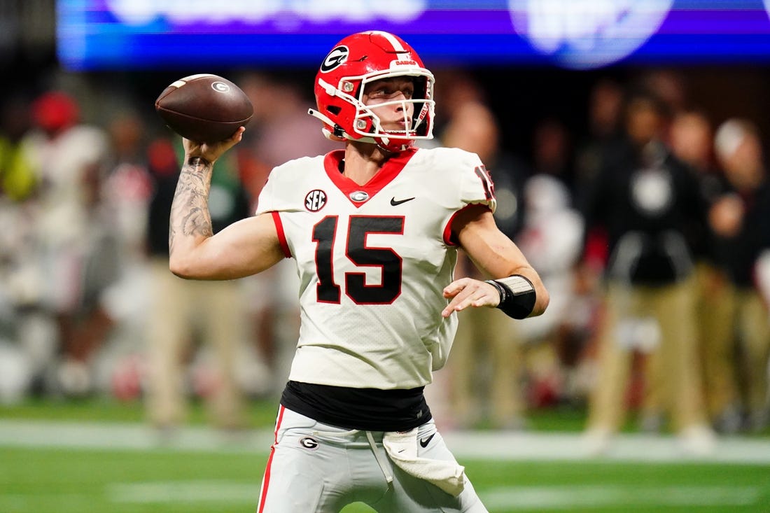 Dec 2, 2023; Atlanta, GA, USA;  Georgia Bulldogs quarterback Carson Beck (15) throws a pass against the Alabama Crimson Tide in the third quarter of the SEC Championship at Mercedes-Benz Stadium. Mandatory Credit: John David Mercer-USA TODAY Sports