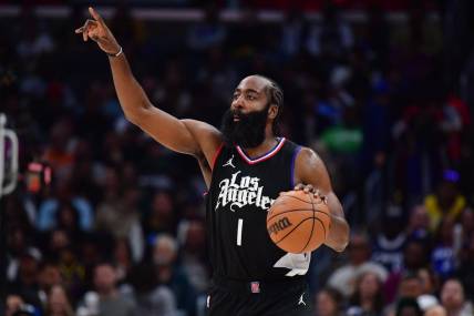 Dec 2, 2023; Los Angeles, California, USA; Los Angeles Clippers guard James Harden (1) moves the ball up court against the Golden State Warriors during the second half at Crypto.com Arena. Mandatory Credit: Gary A. Vasquez-USA TODAY Sports