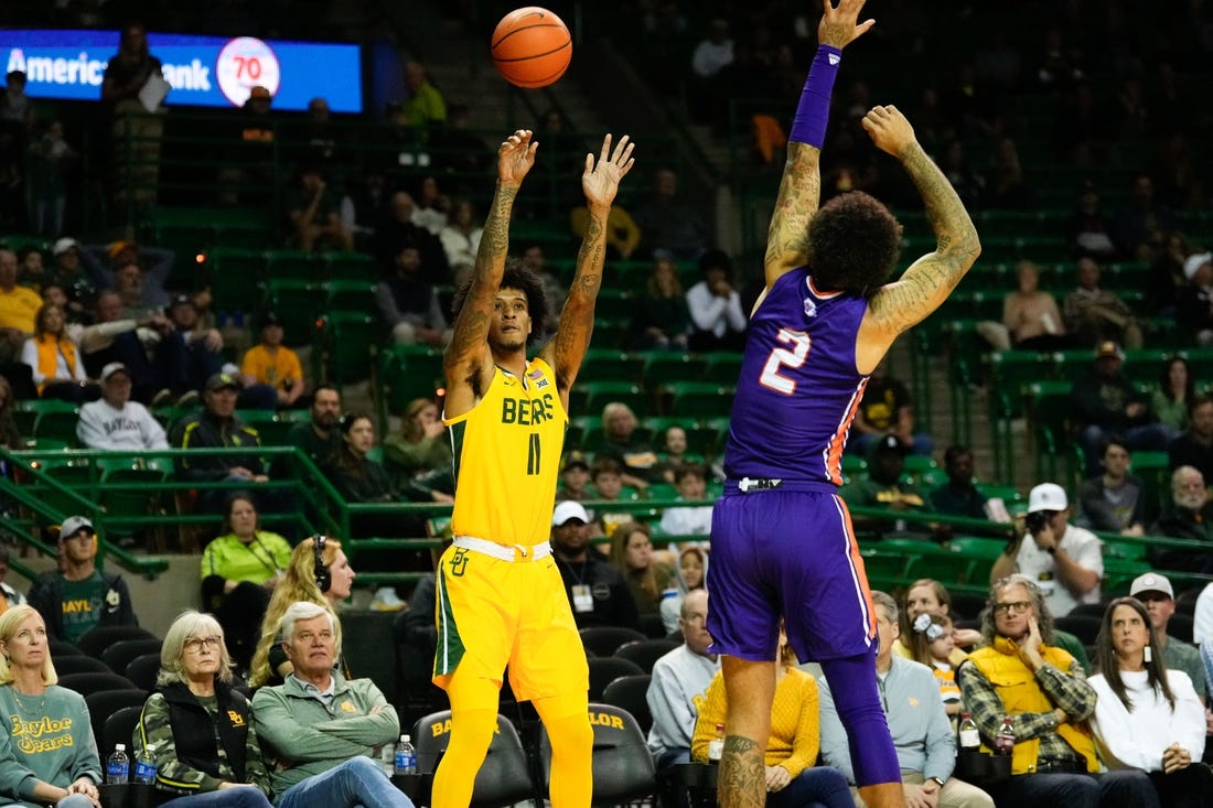 Dec 2, 2023; Waco, Texas, USA; Baylor Bears forward Jalen Bridges (11) scores a three point basket against Northwestern State Demons guard Jamison Epps (2) during the first half at Ferrell Center. Mandatory Credit: Chris Jones-USA TODAY Sports