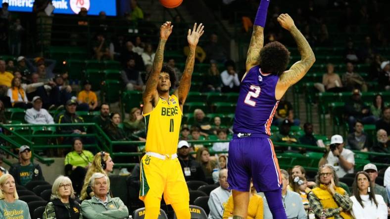 Dec 2, 2023; Waco, Texas, USA; Baylor Bears forward Jalen Bridges (11) scores a three point basket against Northwestern State Demons guard Jamison Epps (2) during the first half at Ferrell Center. Mandatory Credit: Chris Jones-USA TODAY Sports