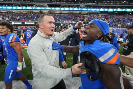 Dec 2, 2023; Las Vegas, NV, USA; Boise State Broncos head coach Spencer Danielson celebrates with running back Ashton Jeanty (2) after 44-20 victory over the UNLV Rebels in the Mountain West Championship at Allegiant Stadium. Mandatory Credit: Kirby Lee-USA TODAY Sports