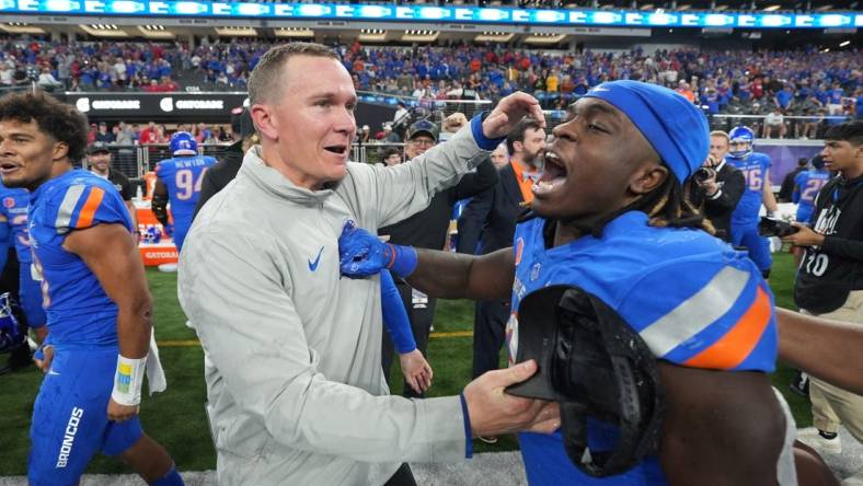 Dec 2, 2023; Las Vegas, NV, USA; Boise State Broncos head coach Spencer Danielson celebrates with running back Ashton Jeanty (2) after 44-20 victory over the UNLV Rebels in the Mountain West Championship at Allegiant Stadium. Mandatory Credit: Kirby Lee-USA TODAY Sports