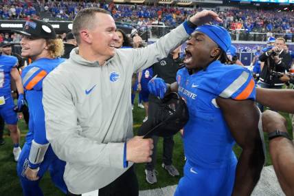 Dec 2, 2023; Las Vegas, NV, USA; Boise State Broncos head coach Spencer Danielson celebrates with running back Ashton Jeanty (2) after 44-20 victory over the UNLV Rebels in the Mountain West Championship at Allegiant Stadium. Mandatory Credit: Kirby Lee-USA TODAY Sports
