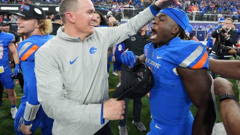 Dec 2, 2023; Las Vegas, NV, USA; Boise State Broncos head coach Spencer Danielson celebrates with running back Ashton Jeanty (2) after 44-20 victory over the UNLV Rebels in the Mountain West Championship at Allegiant Stadium. Mandatory Credit: Kirby Lee-USA TODAY Sports