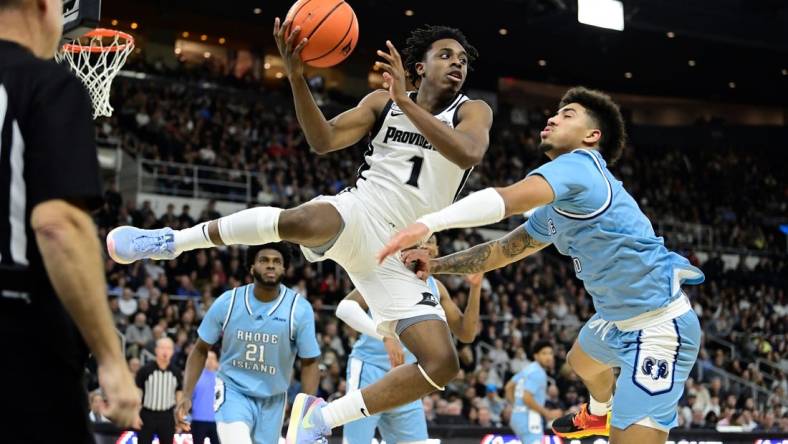 Dec 2, 2023; Providence, Rhode Island, USA; Providence Friars guard Jayden Pierre (1) grabs his own rebound during the first half against the Rhode Island Rams at Amica Mutual Pavilion. Mandatory Credit: Eric Canha-USA TODAY Sports