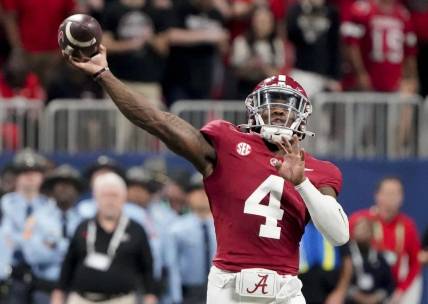 Dec 2, 2023; Atlanta, GA, USA;  Alabama Crimson Tide quarterback Jalen Milroe (4) throws against Georgia at Mercedes-Benz Stadium. Milroe was named the MVP. Alabama defeated Georgia 27-24 to claim the SEC Championship. Mandatory Credit: Gary Cosby Jr.-USA TODAY Sports