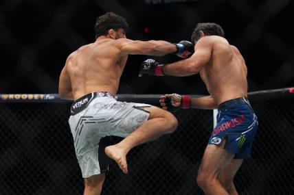 Dec 2, 2023; Austin, Texas, USA; Beneil Dariush (red gloves) fights Arman Tsarukyan (blue gloves) during UFC Fight Night at Moody Center. Mandatory Credit: Dustin Safranek-USA TODAY Sports