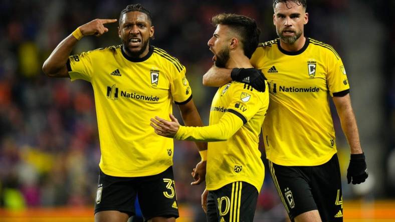 Dec 2, 2023; Cincinnati, Ohio, USA; Columbus Crew defender Steven Moreira (31) and defender Rudy Camacho (4) celebrate a goal by forward Diego Rossi (10) during the second half of the MLS Cup Eastern Conference Finals against the FC Cincinnati against the Columbus Crew at TQL Stadium.