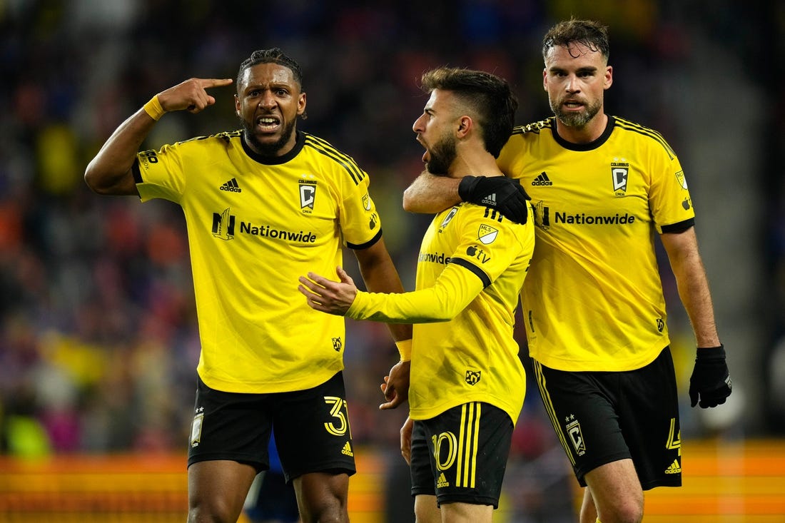 Dec 2, 2023; Cincinnati, Ohio, USA; Columbus Crew defender Steven Moreira (31) and defender Rudy Camacho (4) celebrate a goal by forward Diego Rossi (10) during the second half of the MLS Cup Eastern Conference Finals against the FC Cincinnati against the Columbus Crew at TQL Stadium.