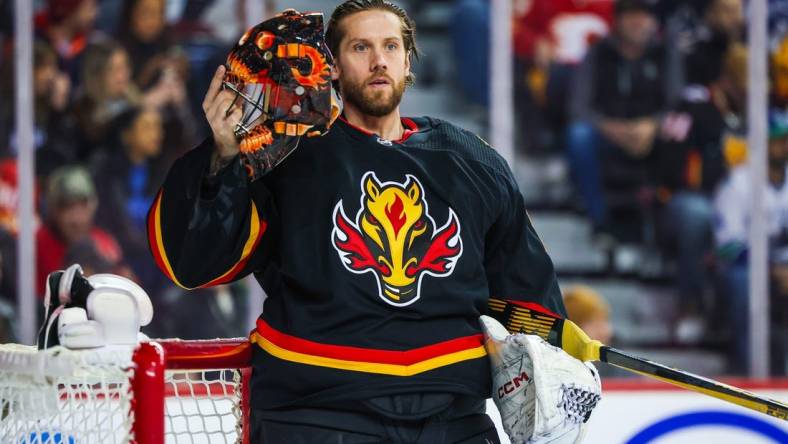 Dec 2, 2023; Calgary, Alberta, CAN; Calgary Flames goaltender Jacob Markstrom (25) during the first period against the Vancouver Canucks at Scotiabank Saddledome. Mandatory Credit: Sergei Belski-USA TODAY Sports