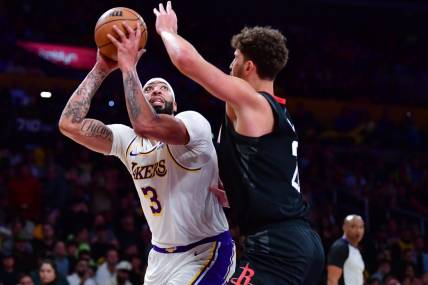 Dec 2, 2023; Los Angeles, California, USA; Los Angeles Lakers forward Anthony Davis (3) moves to the basket against Houston Rockets center Alperen Sengun (28) during the first half at Crypto.com Arena. Mandatory Credit: Gary A. Vasquez-USA TODAY Sports