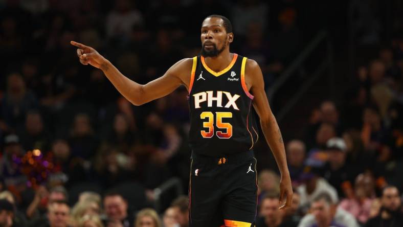 Dec 2, 2023; Phoenix, Arizona, USA; Phoenix Suns forward Kevin Durant (35) against the Memphis Grizzlies in the second half at Footprint Center. Mandatory Credit: Mark J. Rebilas-USA TODAY Sports