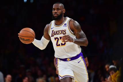 Dec 2, 2023; Los Angeles, California, USA; Los Angeles Lakers forward LeBron James (23) controls the ball against the Houston Rockets during the first half at Crypto.com Arena. Mandatory Credit: Gary A. Vasquez-USA TODAY Sports