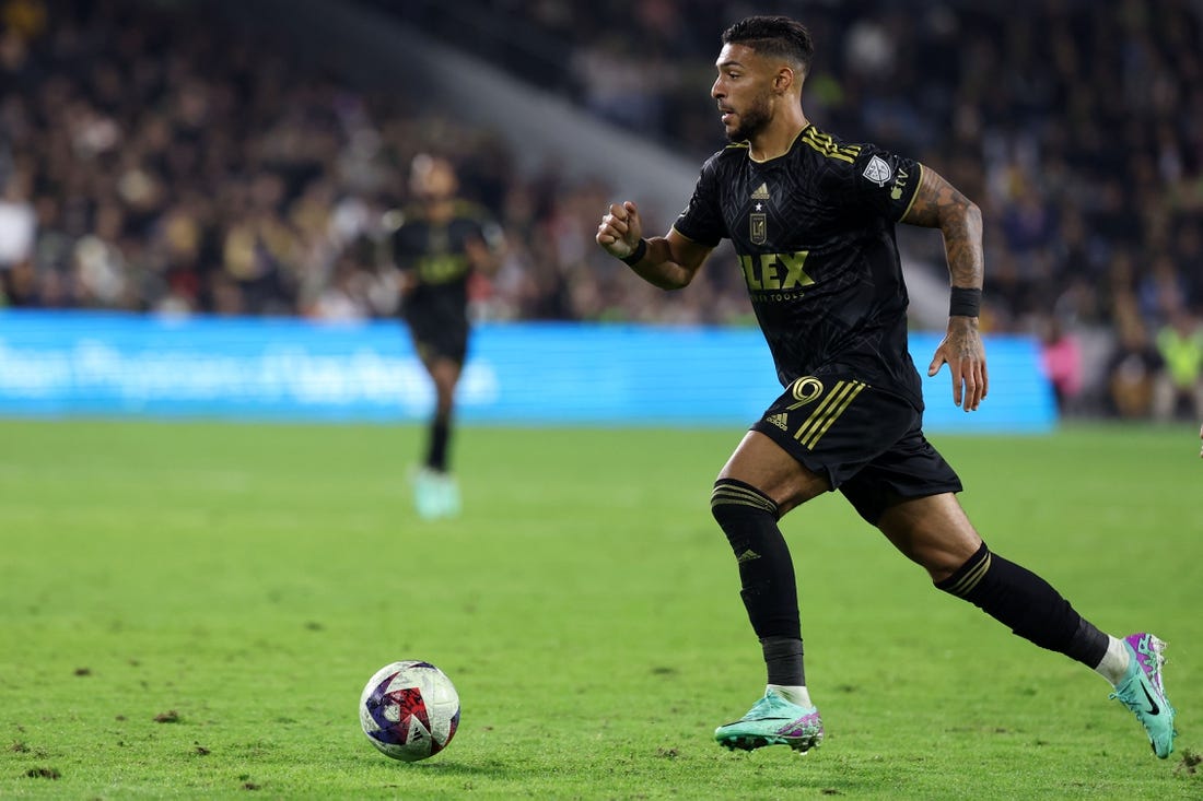 Dec 2, 2023; Los Angeles, California, USA;  Los Angeles FC forward Denis Bouanga (99) dribbles the ball during the second half against the Houston Dynamo at BMO Stadium. Mandatory Credit: Kiyoshi Mio-USA TODAY Sports