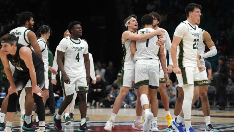 Dec 2, 2023; Las Vegas, Nevada, USA; Colorado State Rams guard Isaiah Stevens (4), forward Joel Scott (1) and guard Cam Lowe (22) celebrate after the Legends of Basketball Las Vegas Invitational game against the Washington Huskies at MGM Grand Garden Arena. Mandatory Credit: Kirby Lee-USA TODAY Sports