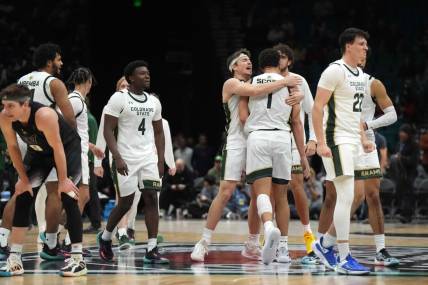 Dec 2, 2023; Las Vegas, Nevada, USA; Colorado State Rams guard Isaiah Stevens (4), forward Joel Scott (1) and guard Cam Lowe (22) celebrate after the Legends of Basketball Las Vegas Invitational game against the Washington Huskies at MGM Grand Garden Arena. Mandatory Credit: Kirby Lee-USA TODAY Sports