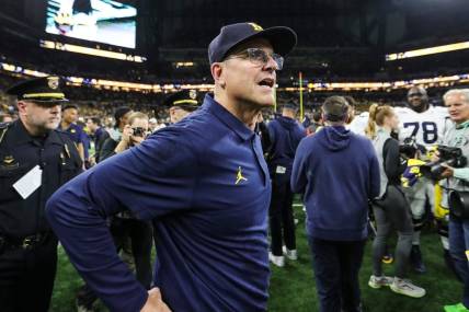 Michigan coach Jim Harbaugh celebrates U-M's 26-0 win over Iowa in the Big Ten championship game in Indianapolis on Saturday, Dec. 2, 2023.