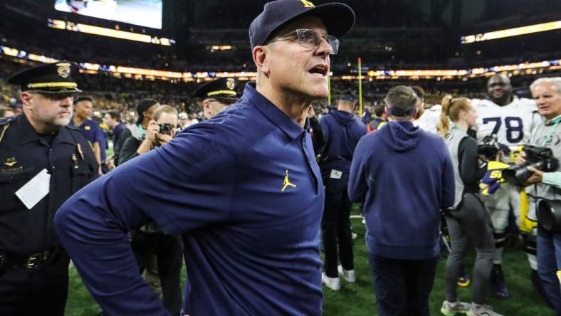 Michigan coach Jim Harbaugh celebrates U-M's 26-0 win over Iowa in the Big Ten championship game in Indianapolis on Saturday, Dec. 2, 2023.