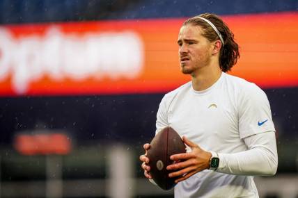 Dec 3, 2023; Foxborough, Massachusetts, USA; Los Angeles Chargers quarterback Justin Herbert (10) warm up before the start of the game against the New England Patriots at Gillette Stadium. Mandatory Credit: David Butler II-USA TODAY Sports