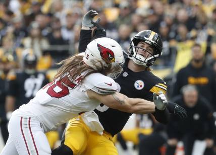 Dec 3, 2023; Pittsburgh, Pennsylvania, USA; Arizona Cardinals linebacker Dennis Gardeck (45) hits Pittsburgh Steelers quarterback Kenny Pickett (8) as he releases the football during the first quarter at Acrisure Stadium. Mandatory Credit: Charles LeClaire-USA TODAY Sports