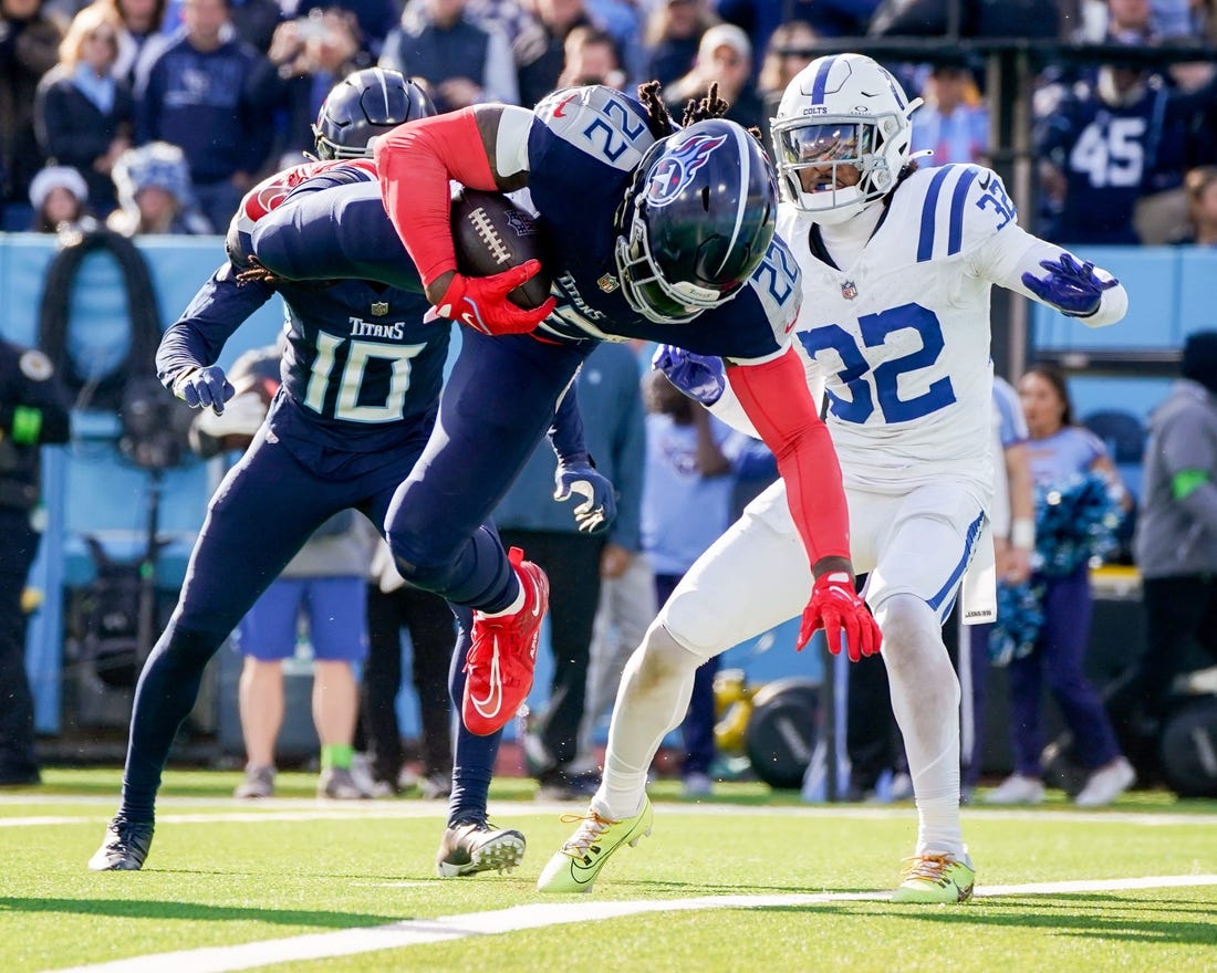 Tennessee Titans running back Derrick Henry (22) leaps for a touchdown against the Indianapolis Colts during the second quarter at Nissan Stadium in Nashville, Tenn., Sunday, Dec. 3, 2023.