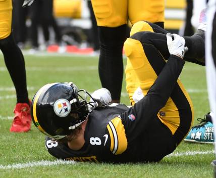 Dec 3, 2023; Pittsburgh, Pennsylvania, USA; Pittsburgh Steelers quarterback Kenny Pickett (8) grabs his leg after play against the Arizona Cardinals during the second quarter at Acrisure Stadium. Pickett left the game with an injury. Mandatory Credit: Philip G. Pavely-USA TODAY Sports