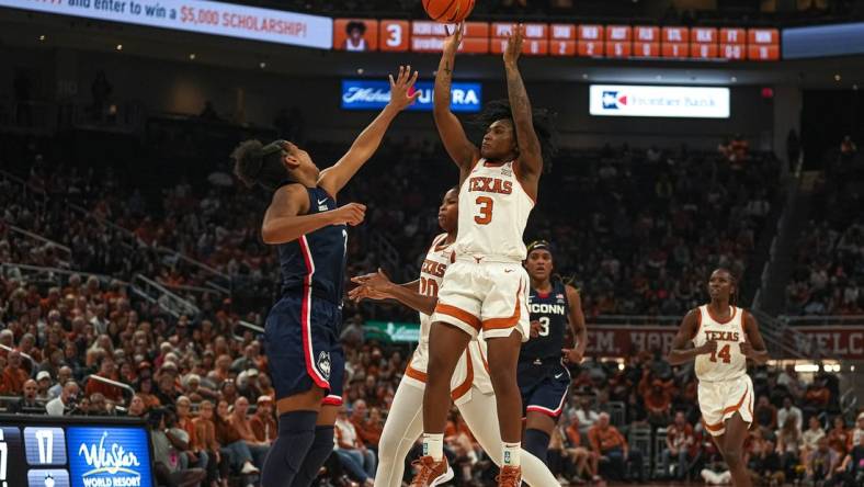 Texas Longhorns guard Rori Harmon (3) shoots over University of Connecticut guard KK Arnold (2) during the women   s basketball game at the Moody Center on Sunday, Dec. 3, 2023 in Austin.