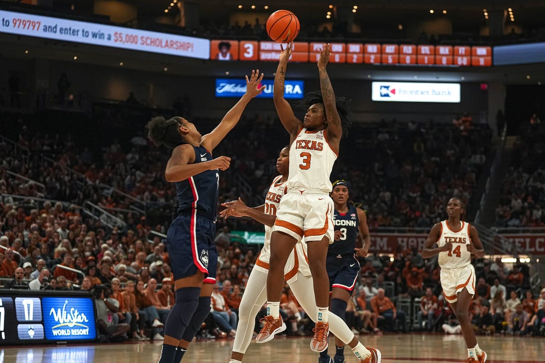 Texas Longhorns guard Rori Harmon (3) shoots over University of Connecticut guard KK Arnold (2) during the women   s basketball game at the Moody Center on Sunday, Dec. 3, 2023 in Austin.