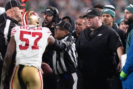 Dec 3, 2023; Philadelphia, Pennsylvania, USA; San Francisco 49ers linebacker Dre Greenlaw (57) has an altercation with Philadelphia Eagles staff member Dom DiSandro during the third quarter at Lincoln Financial Field. Mandatory Credit: Bill Streicher-USA TODAY Sports