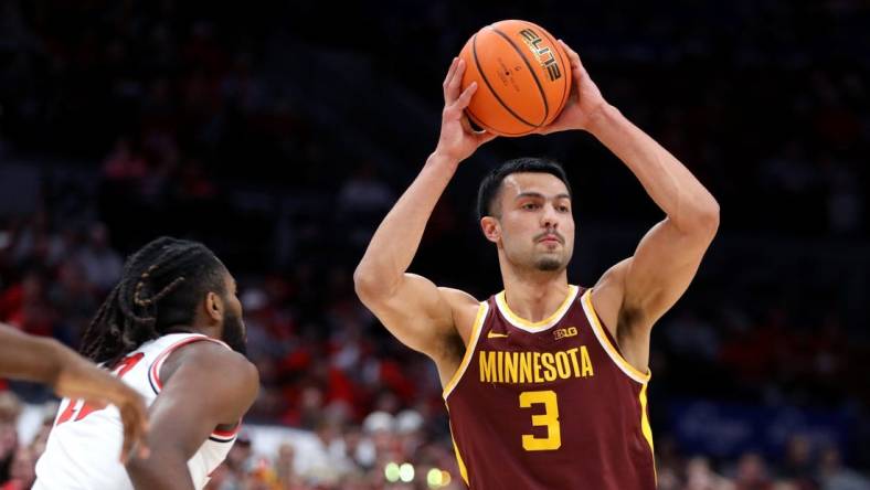 Dec 3, 2023; Columbus, Ohio, USA;  Minnesota Golden Gophers forward Dawson Garcia (3) looks to pass as Ohio State Buckeyes guard Evan Mahaffey (12) during the first half at Value City Arena. Mandatory Credit: Joseph Maiorana-USA TODAY Sports